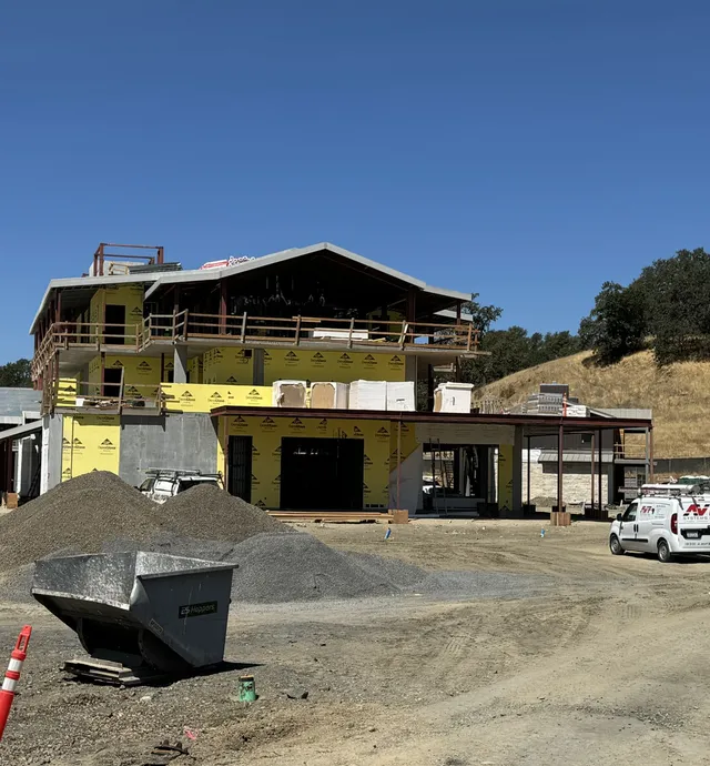 Main building siding and exterior finishes are in progress